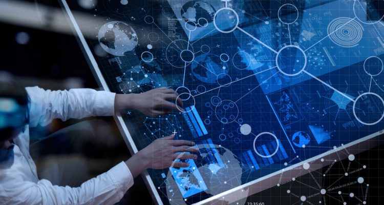 top-view-of-businessman-hand-working-with-modern-technology-and-digital-layer-effect-as-business-strategy-750x400